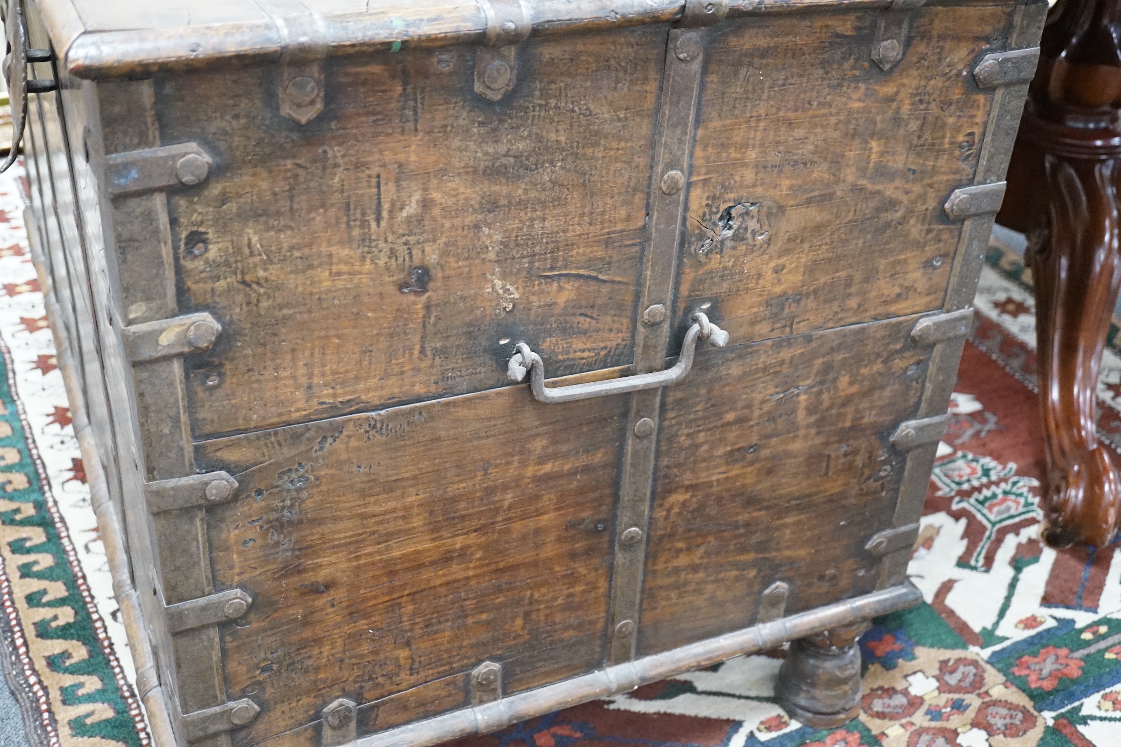 A 19th century Indian iron bound hardwood trunk, width 99cm, depth 64cm, height 70cm